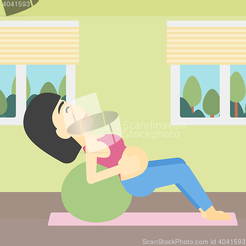 Image of Pregnant woman on gymnastic ball.