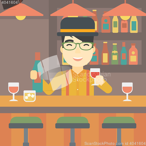 Image of Bartender standing at the bar counter.