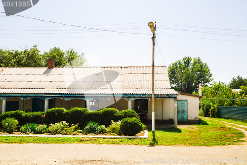 Image of Rural house with tiled roof and garden