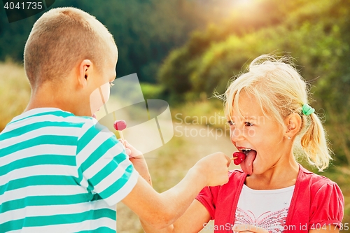 Image of Children with lollipops