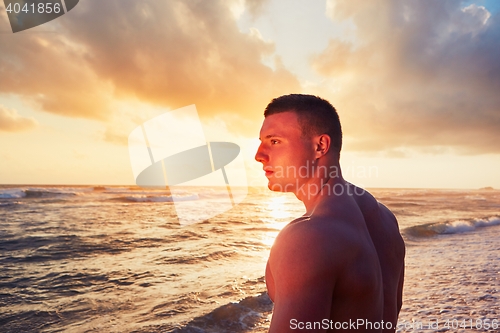 Image of Athletic man on the tropical beach