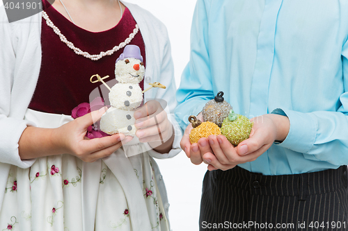 Image of Children holding christmas dessert