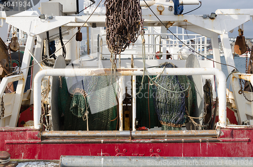 Image of back of a big fishingboat in the harbour