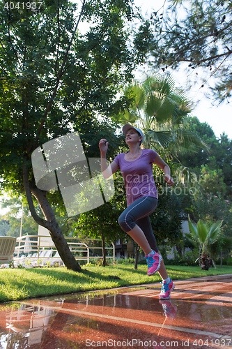 Image of sporty woman jogging