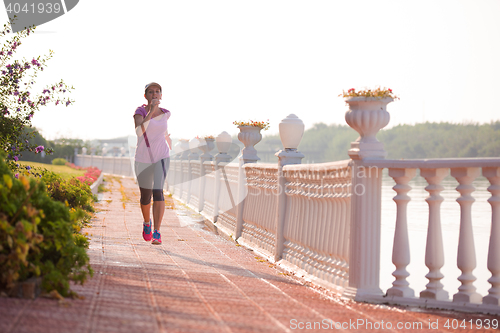 Image of sporty woman jogging