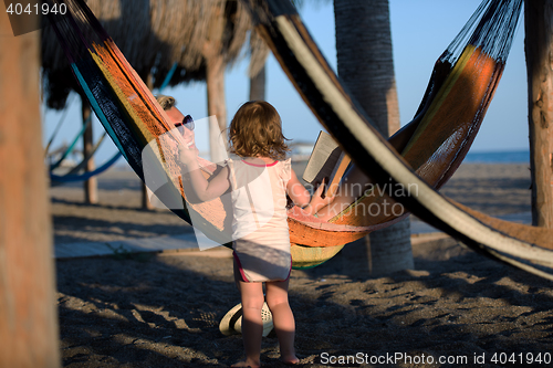 Image of relaxed woman laying in hammock