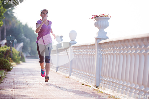 Image of sporty woman jogging