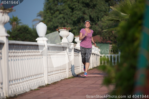 Image of sporty woman jogging