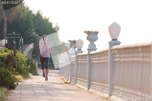 Image of sporty woman jogging