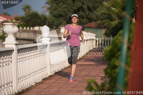 Image of sporty woman jogging