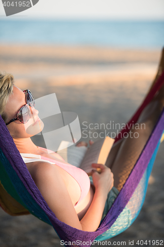 Image of relaxed woman laying in hammock