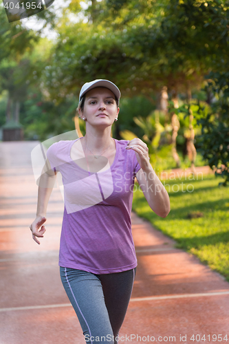 Image of sporty woman jogging