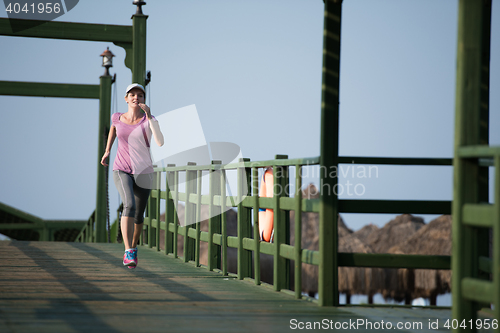 Image of sporty woman jogging