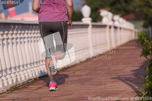 Image of sporty woman jogging