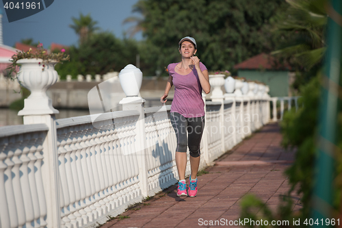 Image of sporty woman jogging