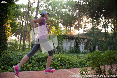 Image of sporty woman jogging