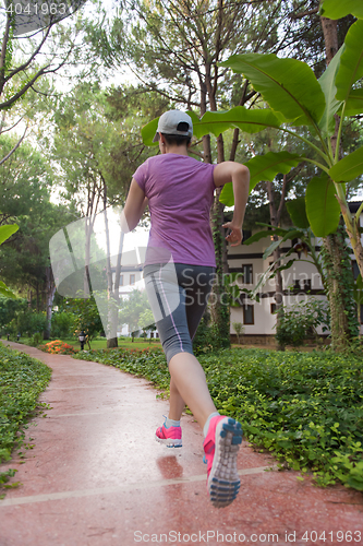 Image of sporty woman jogging