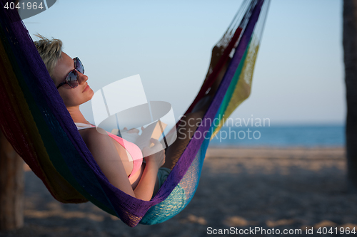 Image of relaxed woman laying in hammock