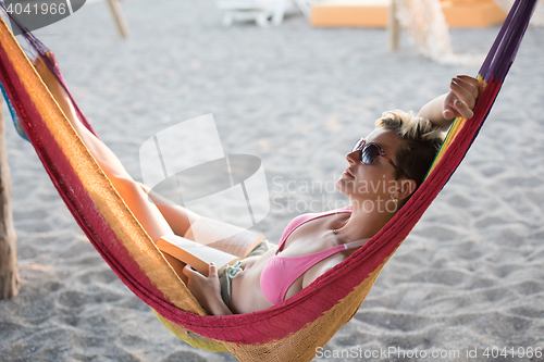 Image of relaxed woman laying in hammock