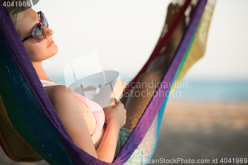 Image of relaxed woman laying in hammock