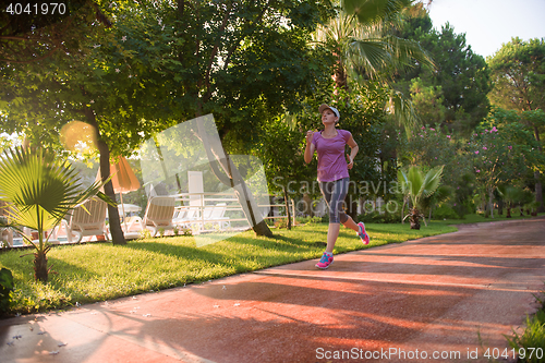Image of sporty woman jogging