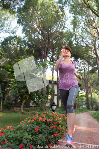 Image of sporty woman jogging