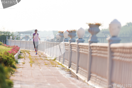 Image of sporty woman jogging