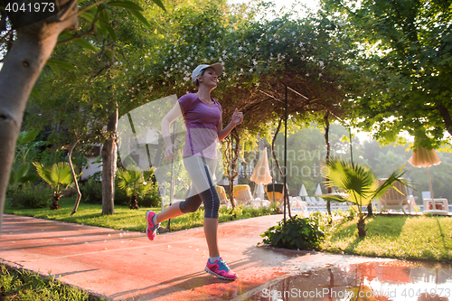 Image of sporty woman jogging