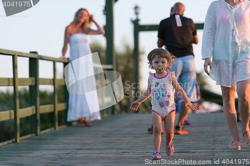 Image of girl and mother walking