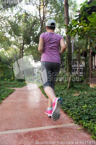 Image of sporty woman jogging