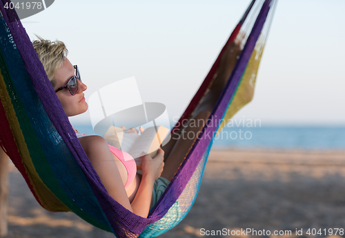 Image of relaxed woman laying in hammock