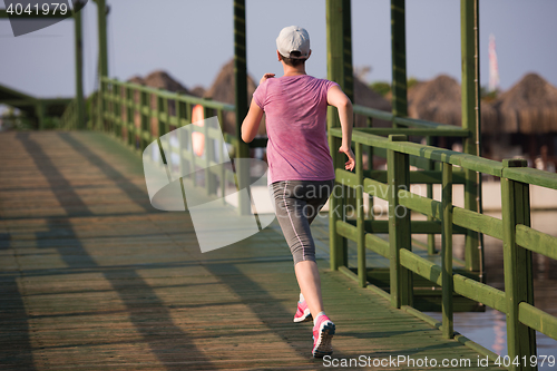 Image of sporty woman jogging