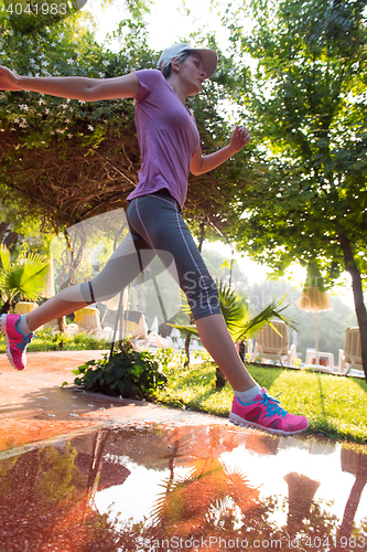 Image of sporty woman jogging