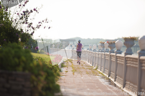 Image of sporty woman jogging