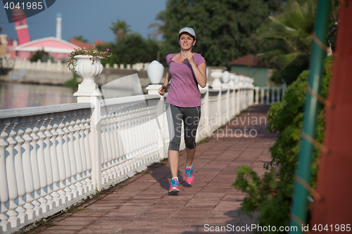 Image of sporty woman jogging