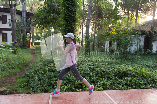 Image of sporty woman jogging