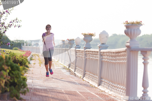 Image of sporty woman jogging