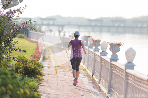 Image of sporty woman jogging