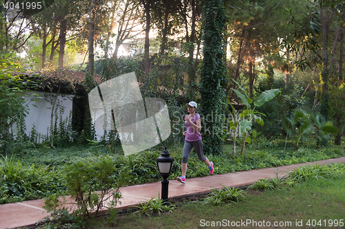 Image of sporty woman jogging