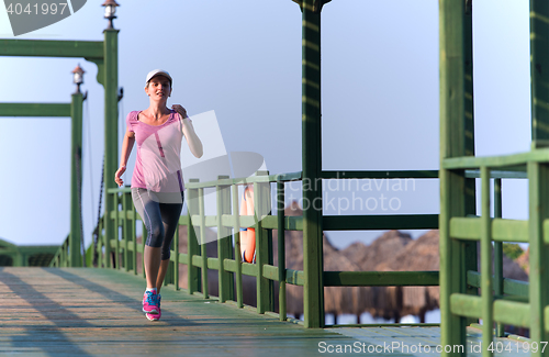 Image of sporty woman jogging