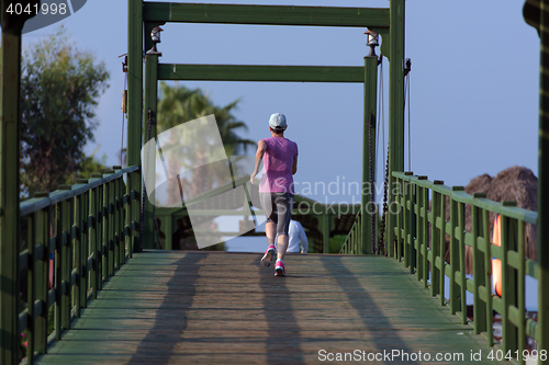 Image of sporty woman jogging