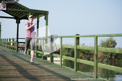 Image of sporty woman jogging