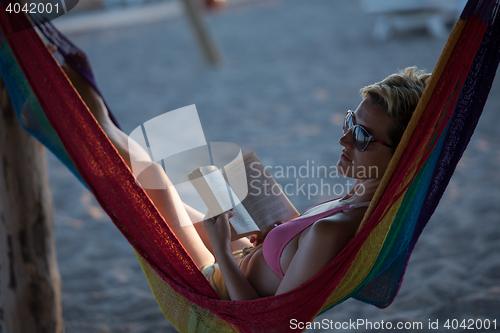 Image of relaxed woman laying in hammock