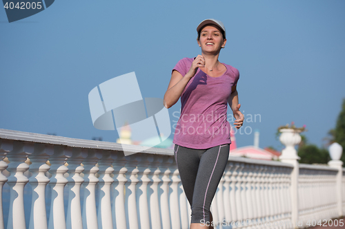 Image of sporty woman jogging