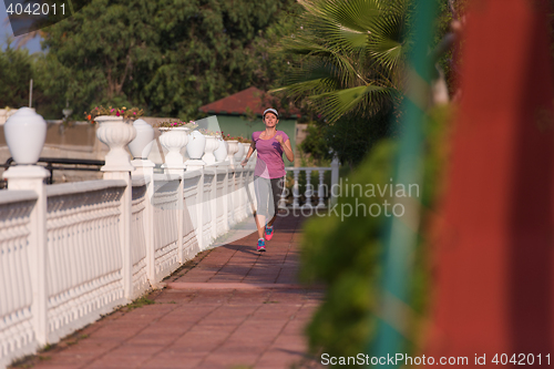 Image of sporty woman jogging