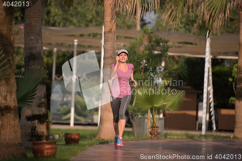 Image of sporty woman jogging