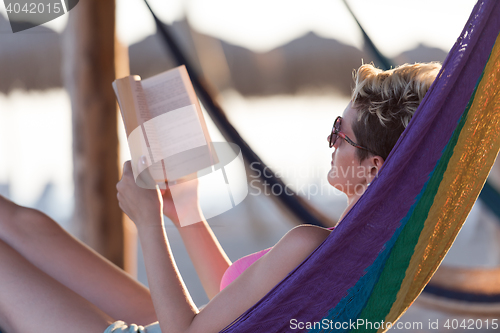 Image of relaxed woman laying in hammock