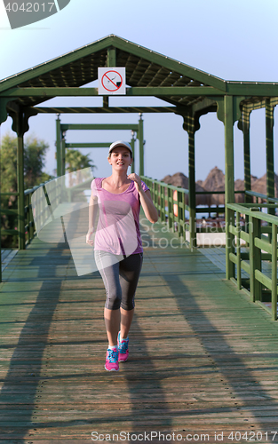 Image of sporty woman jogging