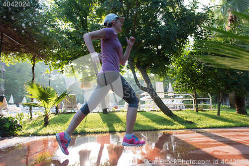 Image of sporty woman jogging