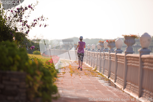 Image of sporty woman jogging